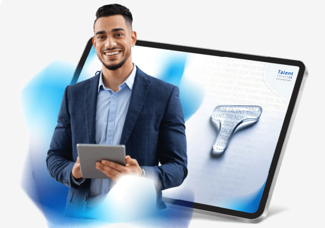 Guy holding an ipad smiling