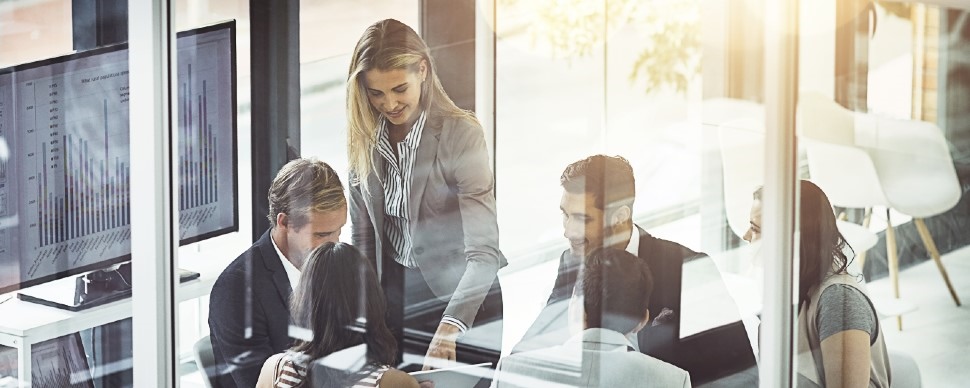 Group of 3 working adults in an office setting