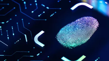 Fingerprint scan on a glowing digital interface.