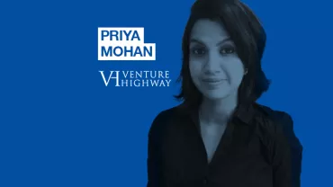 Portrait of a person with dark hair on a blue background with 'Priya Mohan, Venture Highway' written.